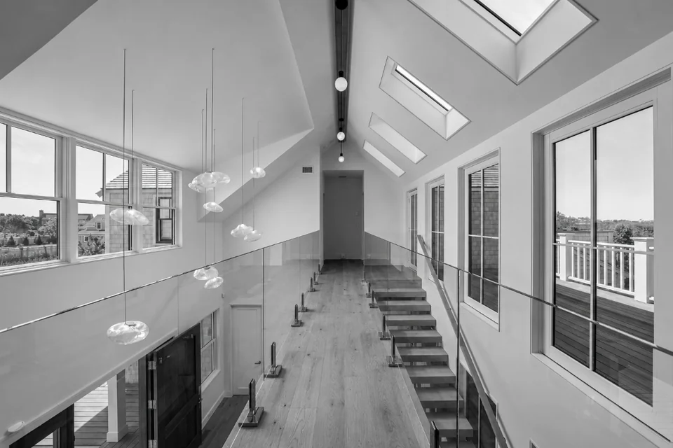 Upper foyer, skylights and glass balustrade at Sconset